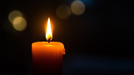 A tiny candle flame glowing against a jet-black void
