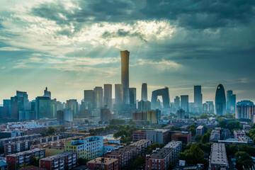 The China Zun in the building complex of China World Trade Center in Beijing, China, with sunlight piercing through the clouds