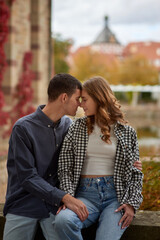 Young Cute Female Hugs Boyfriend. In Autumn Outdoor. Lovers Walking in Park. Attractive Funny Couple. Lovestory in Forest. Man and Woman. Cute Lovers in the Park. Family Concept. Happy Couple.