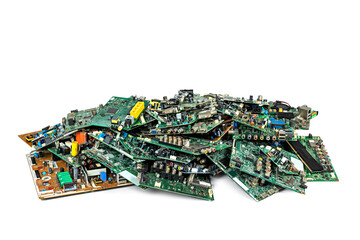 Used and damaged circuit boards piled up on white background, electronic waste for recycling.