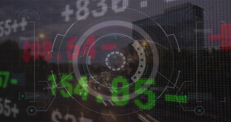 Image of financial data processing over cityscape