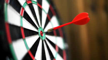 A dart hitting triple 20 on a professional dartboard, sharply in focus