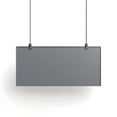 A rectangular gray sign suspended by thin metallic cables