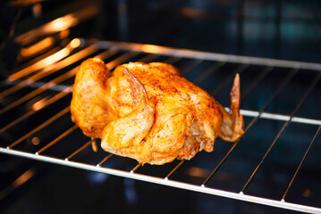Fototapeta premium grilled chicken in the oven on the grill