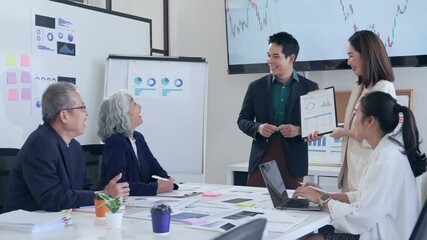 Professional team analyzing market trends, charts, and graphs during collaborative meeting, showcasing strategic decision making in modern corporate environment - Powered by Adobe