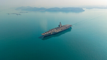 Aerial view navy aircraft carrier at sea.
