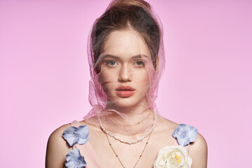 Captivating young woman showcases spring fashion with floral elegance in pastel tones