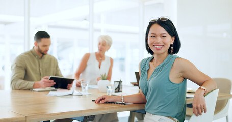 Portrait, happy or woman in a meeting planning a branding, advertising or marketing strategy with business people. Partnership, face or Japanese worker smiles with pride after a successful project