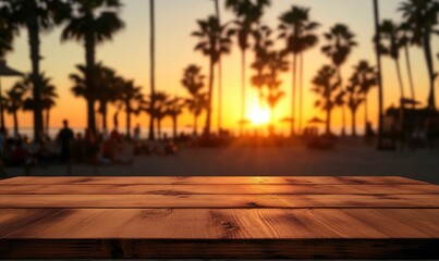 Empty wooden table top with a blurred beach sunset background for product display montage, with palm trees and people in the distance