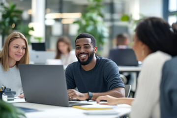 Fototapeta premium Diverse team collaborating and smiling in a modern office.
