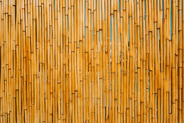 Bamboo or reed straw background. Bamboo or reed straw abstract banner. Close up texture and natural patterns, rustic background perfect for design projects. Mock up.