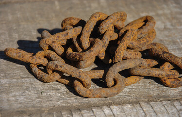 rusty chain on wooden background