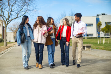 Naklejka premium University students walking and talking on campus
