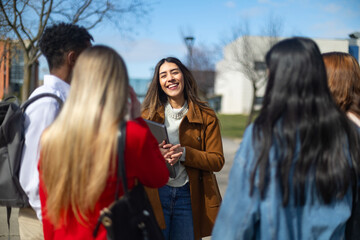 University students talking and smiling on campus