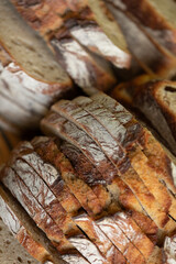 Close-up of rustic, sliced bread. Perfect for bakery, food blogs, and culinary websites.