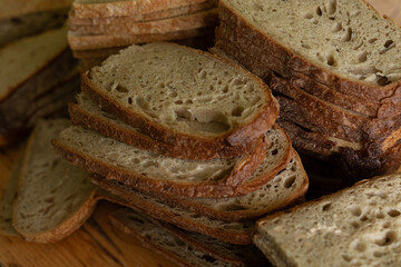 Close-up of rustic sourdough bread slices, perfect for baking and food blogs.