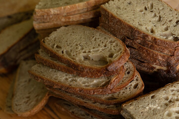 Close-up of rustic sourdough bread slices, perfect for baking blogs or food websites.