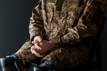 A Soldier with Advanced Bionic Leg Prosthesis in Camouflage Uniform