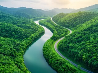 Fototapeta premium Serene Aerial View of Winding River Through Lush Green Forests and Rolling Hills