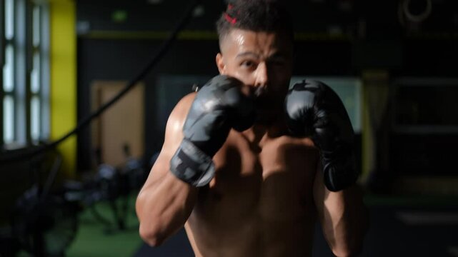 A highly determined boxer is training rigorously in a dynamic and vibrant gym, showcasing both strength and willpower
