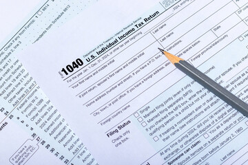 Obraz premium Close-up USA individual income tax return form 1040. Tax payment and filing concept