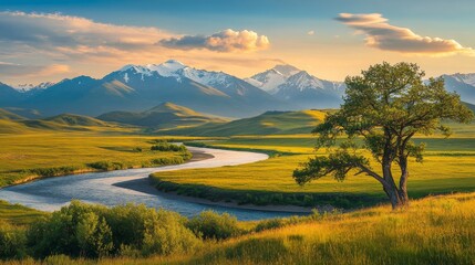 Obraz premium Serene sunset landscape majestic mountains, lush grasslands, and a flowing river under a blue sky
