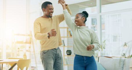 African couple, dancing and home in living room, happy and holding hands for steps, celebration and...
