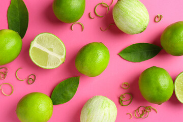 Lime zest, leaves and fresh fruits on pink background