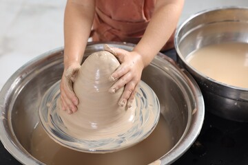 Hobby and craft. Girl making pottery indoors, closeup