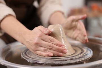 Hobby and craft. Woman making pottery indoors, closeup