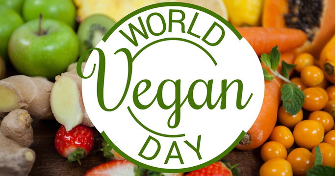 Image of world vegan day text over fruit and vegetables