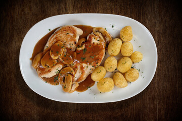 Flambé Grilled Chicken Fillet with potatoes and mushrooms