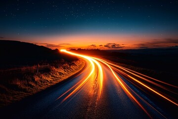 
A long car stream glowing under the night sky, forming interesting lines of light.