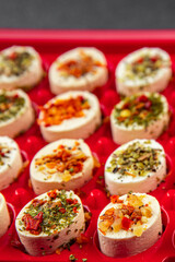 cheese appetizer soft cheese with herbs and tomatoes pieces fresh tasty food dish delicious gourmet food background on the table rustic food top view copy space