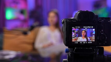 Engaging Conversation in a Vibrant Podcast Studio With a Digital Creator Conducting an Interview