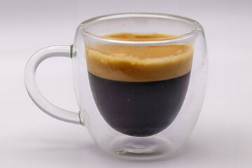 Double Espresso, Isolated in a clear glass coffee cup