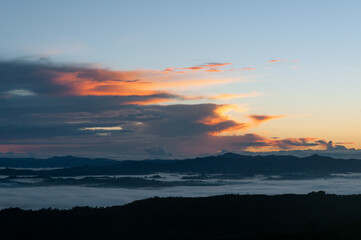 Background of a sunrise in the tropical mountains, showing very arctic orange and blue colors.