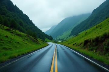 Fototapeta premium A Winding Asphalt Road Through Lush Green Mountain Valley After a Rain