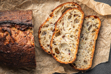 Grain bread sunflower, chia, flax seed, cut oats fresh tasty food dish delicious gourmet food background on the table rustic food top view copy space vegetarian and vegan food