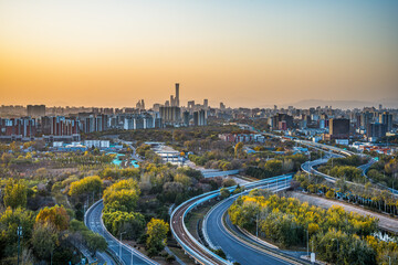 Fototapeta premium The magnificent landscape of the overpass and the city skyline at dusk in Beijing, China