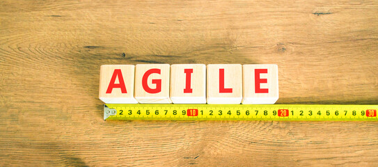 Agile symbol. Concept word Agile on beautiful wooden blocks. Beautiful wooden table wooden...