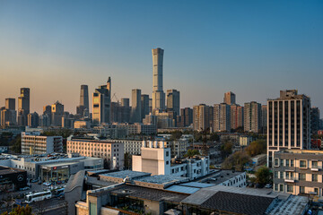 Obraz premium The modern buildings in China World Trade Center in Beijing, China and the residential buildings are captured in the same frame