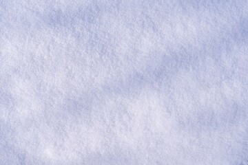 The texture of natural winter snow sparkling in the sun. Beautiful snowy background.