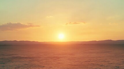 Obraz premium A beautiful golden sunset shining over a serene landscape scenery