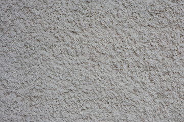 Texture of old rough plaster close-up.