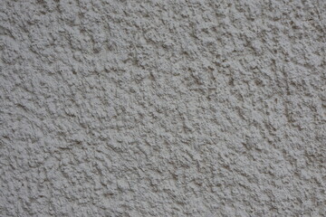 Texture of old rough plaster close-up.