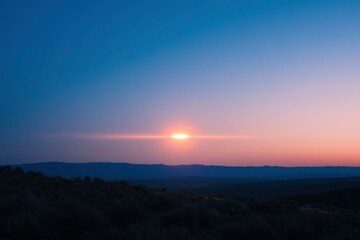 Sunset paints sky over desert hills; Tranquil nature backdrop