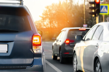 Naklejka premium Cars stuck in row in jam on traffic lights,city street.queue on freeway,highway interstate road.Automobile accident vehicle in rush hour. Transportation
