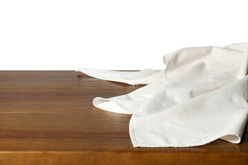 Light tablecloth on wooden table against white background, closeup © New Africa