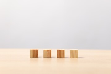 Many wooden cubes on table, space for text